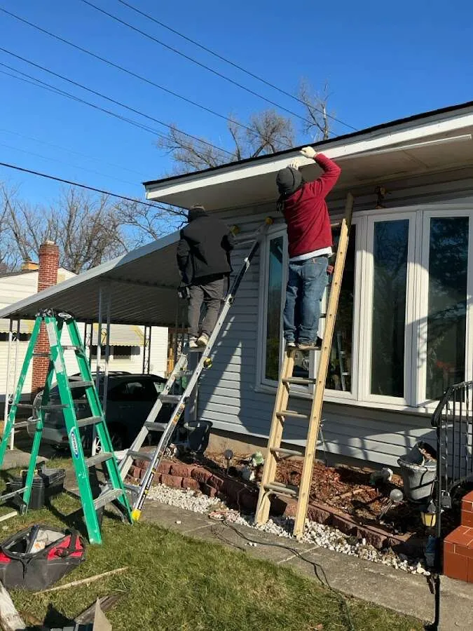Restoration crew performing exterior repair in Iron Mountain